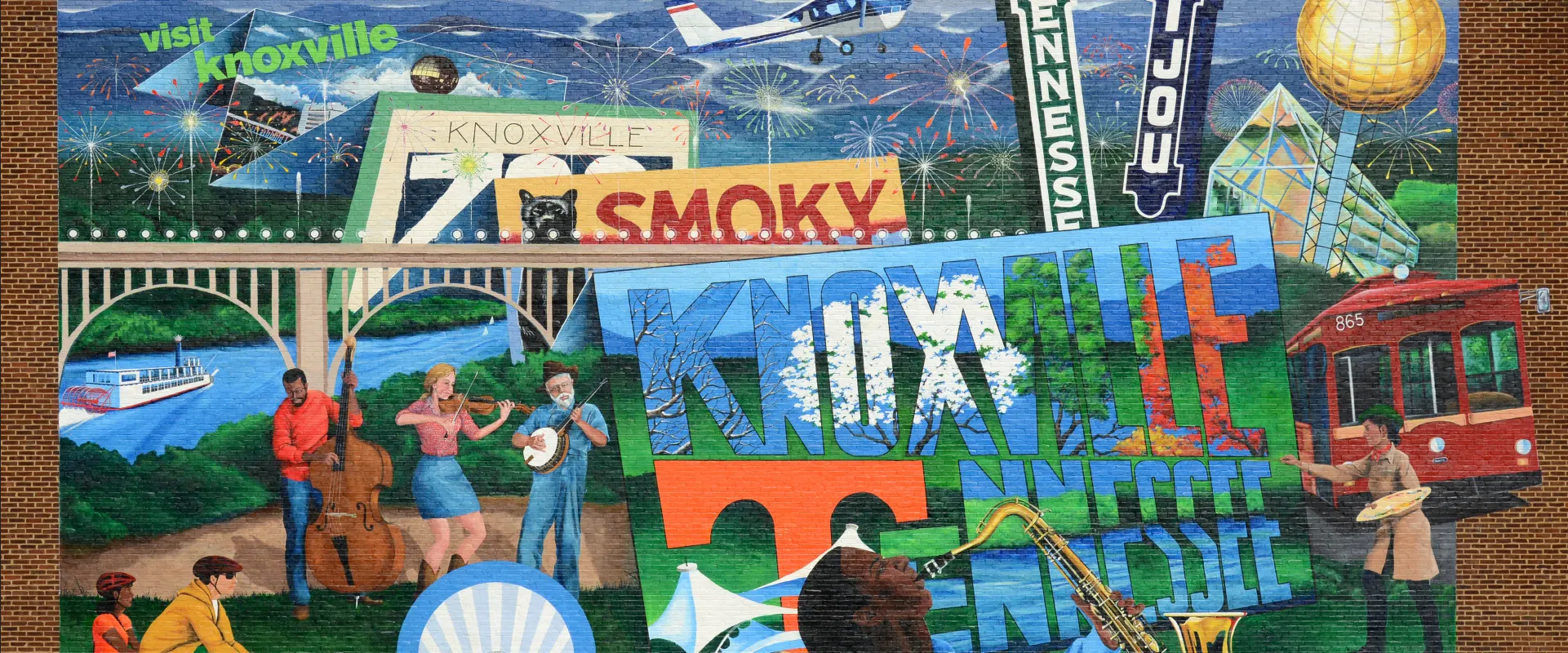 Colorful Knoxville mural showing a band of musicians, a streetcar, a riverboat, a bridge and the Sunsphere. Link to Visit Knoxville things to do.
